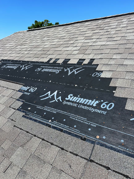 A roof showing subtle but significant hail damage after a storm in Niceville, FL.